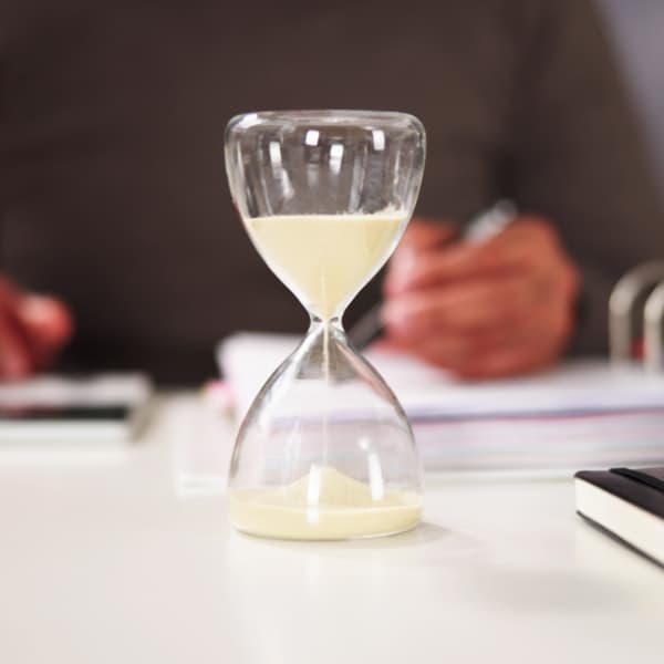Hourglass indicating the need to Put an internal process in place to avoid late payments