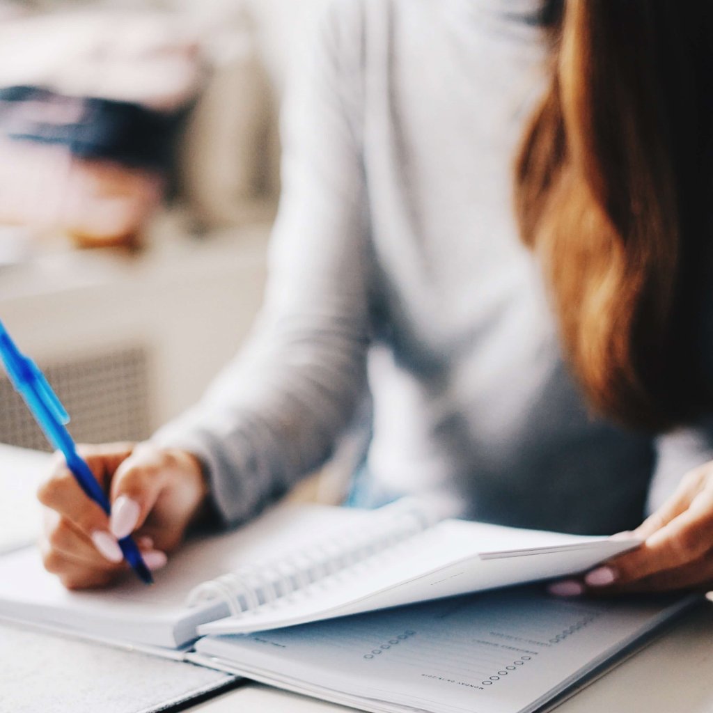 woman adding tax dates into her diary